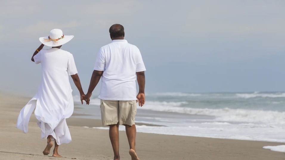 Senior Couple Walking on Beach